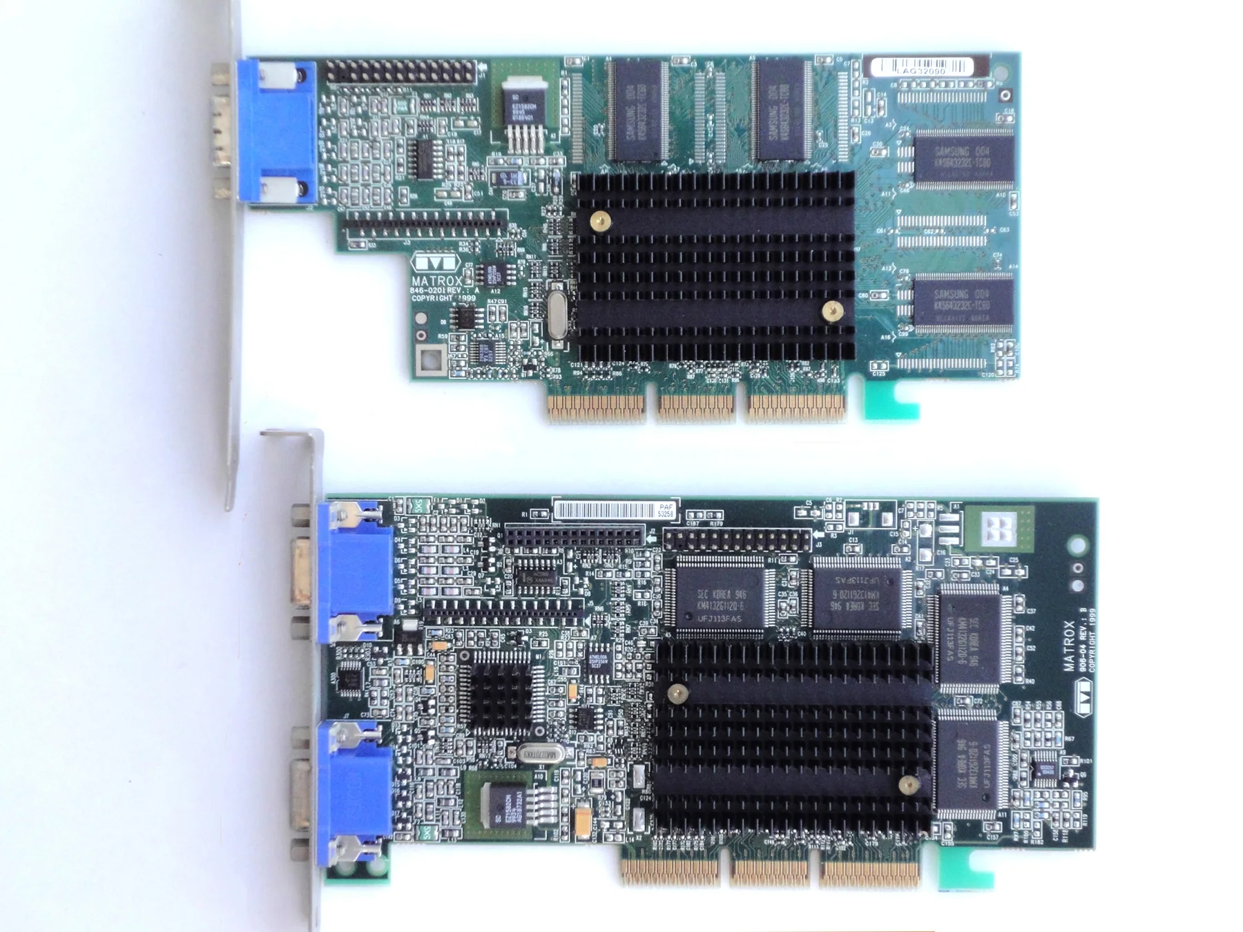 Matrox Millennium G400 graphics cards photographed from above with heatsinks, memory chips, and display connectors visible
