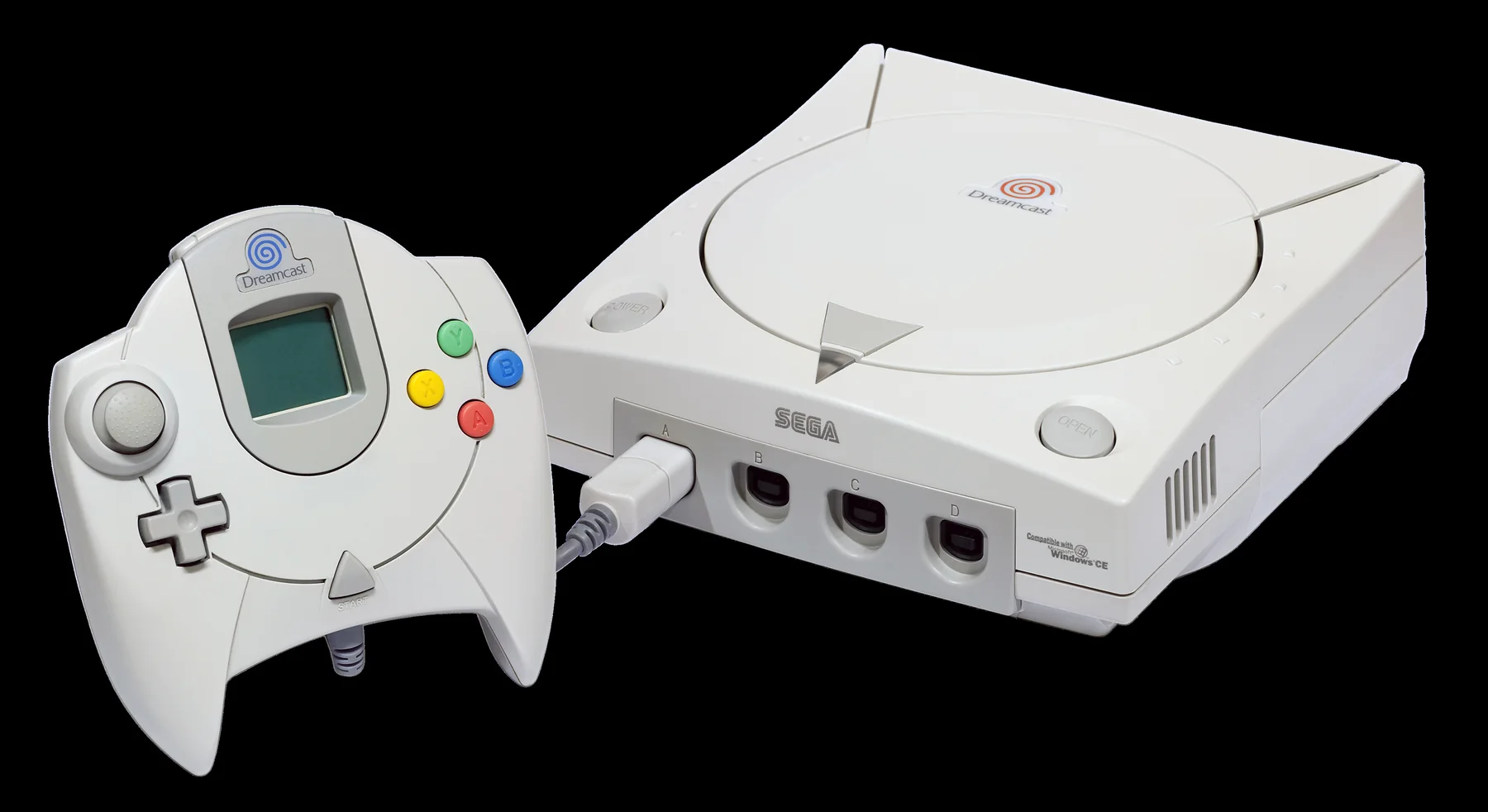 Sega Dreamcast console beside a controller with Visual Memory Unit